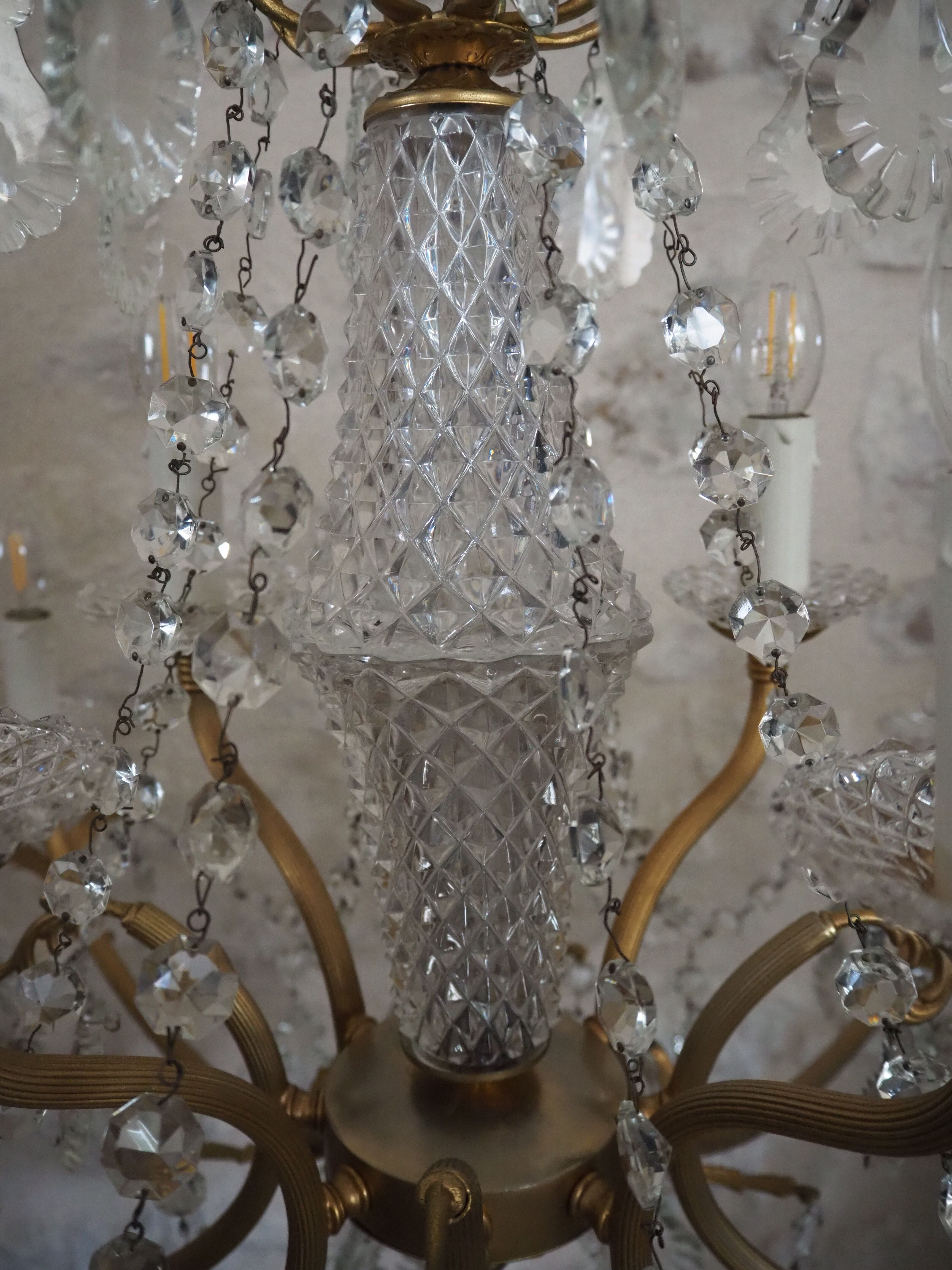 Chandelier 12 lamps with grapevines in crystal, bronze and regulated