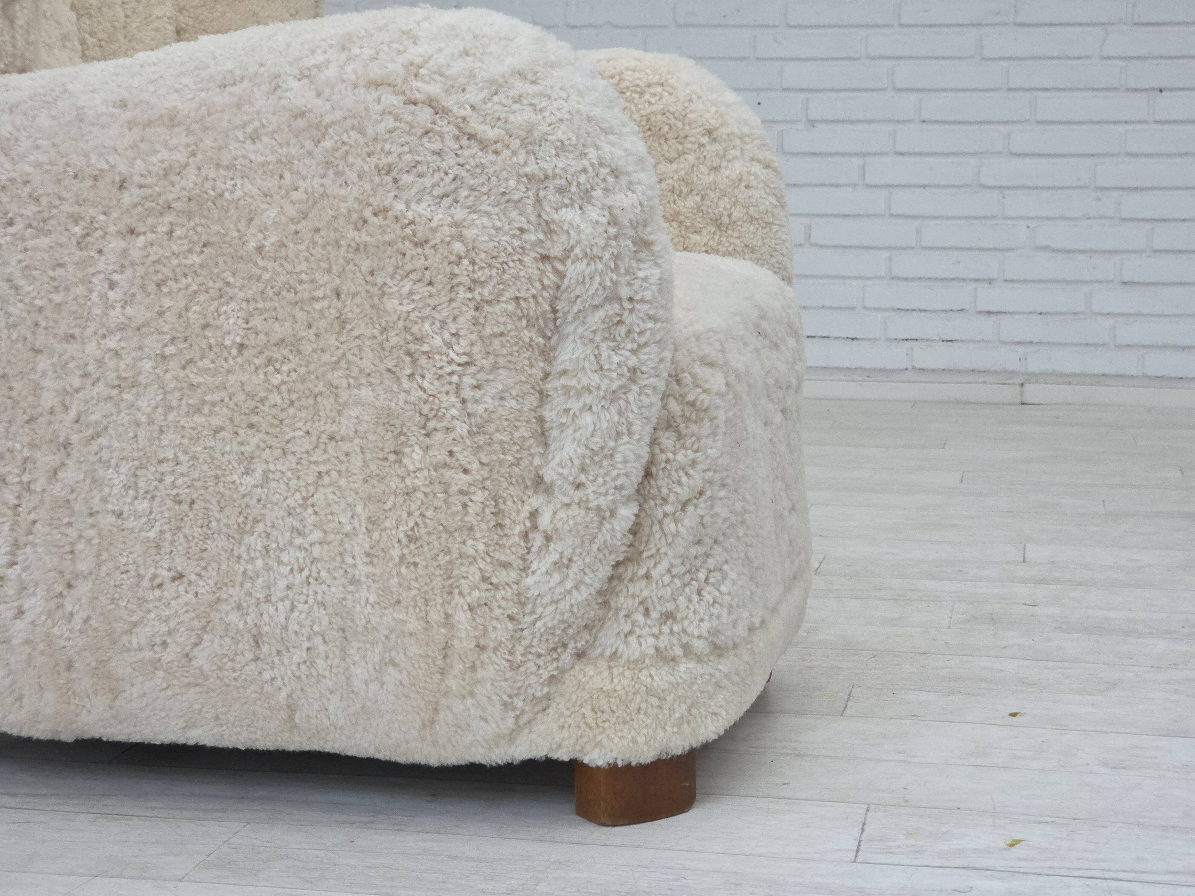 1960s, Danish design, reupholstered highback armchair, genuine sheepskin.