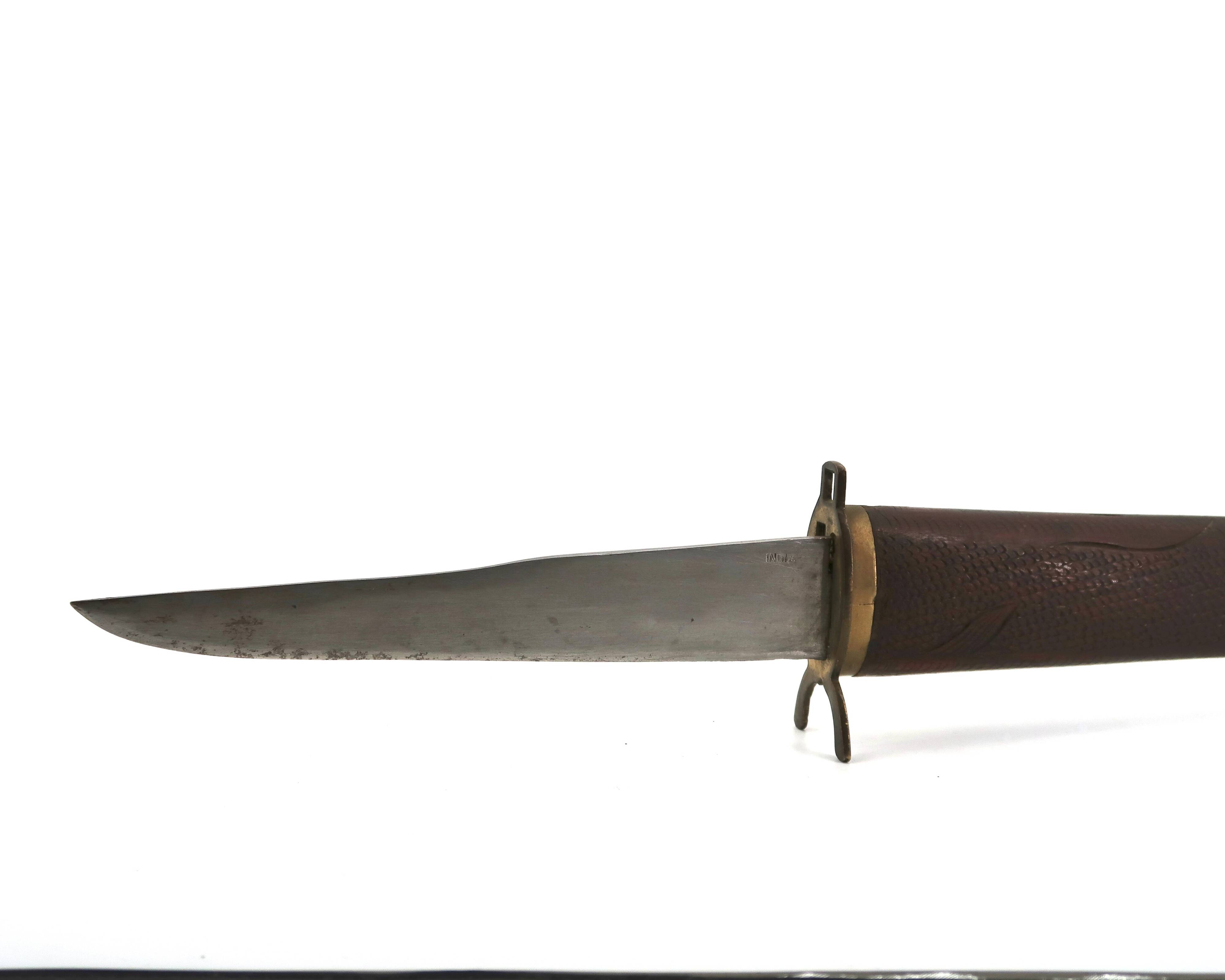 Fish knife and fork with a wooden and brass sheath sculpture.