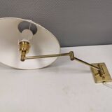Danish Brass wall lamp with a ‘swivel’ effect.
