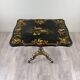 Table pliante Napoléon III en bois laqué noir et décor doré, XIXe siècle