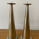 Pair of hammered metal candlesticks
