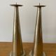 Pair of hammered metal candlesticks