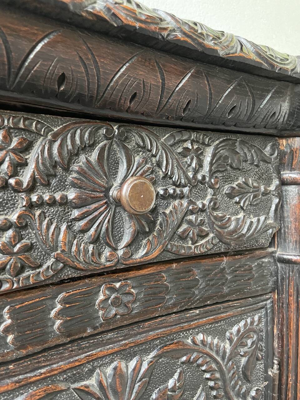 19th century chest of drawers in carved blackened pine