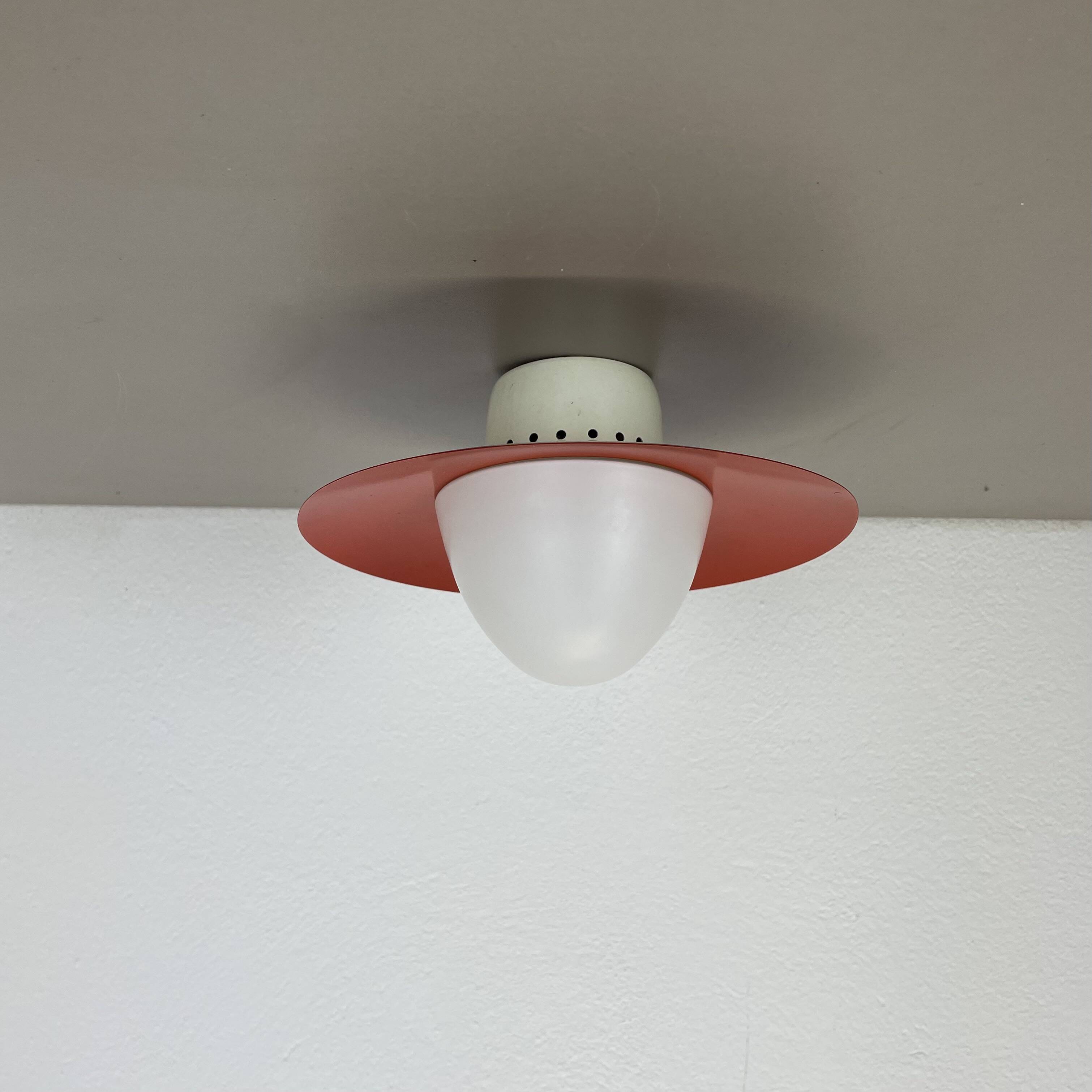 Round red wall light in metal and opaline glass in the Stilnovo style, 20 cm, Italy, 1960s