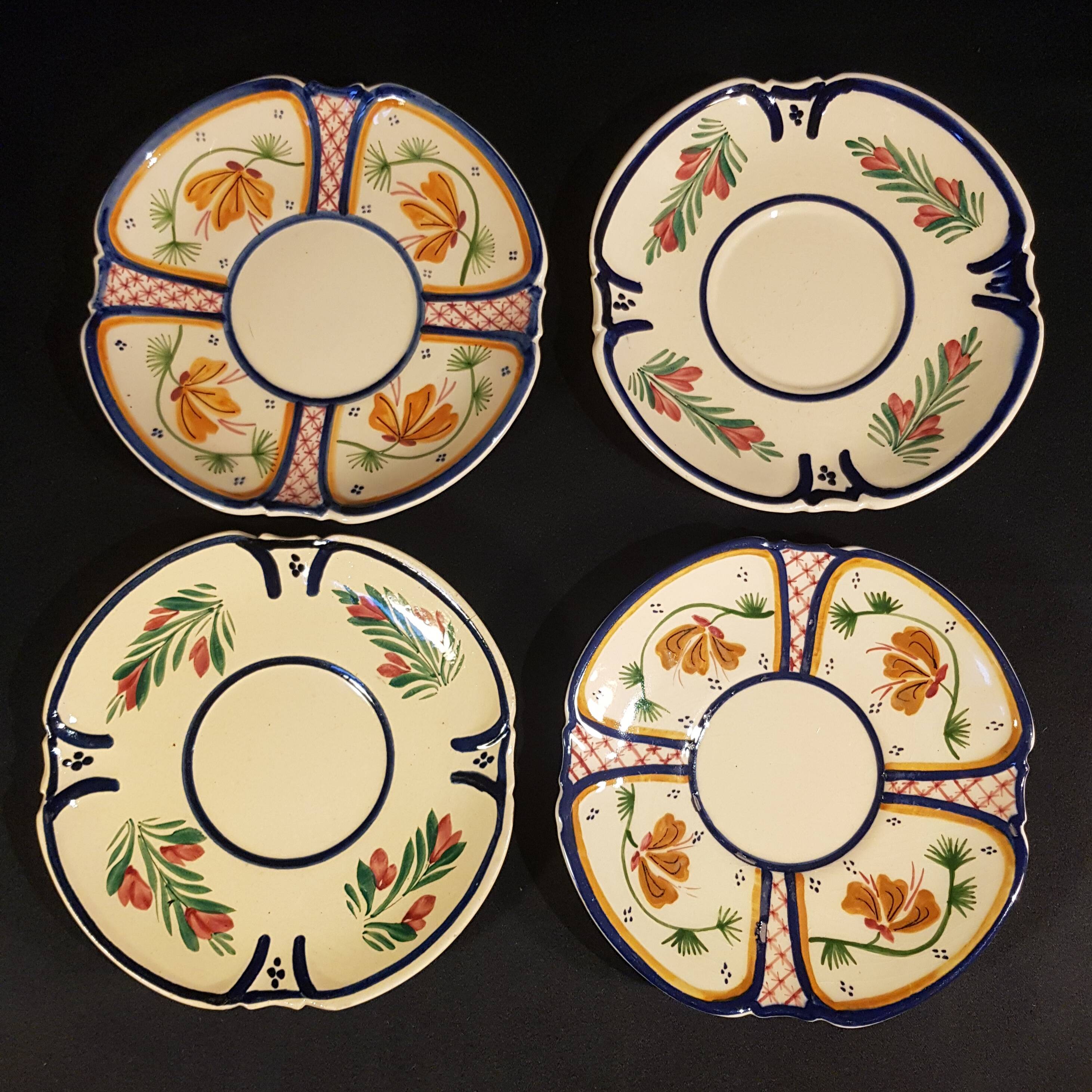 4 Quimper earthenware saucers or plates