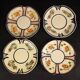 4 Quimper earthenware saucers or plates