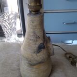 Sandstone lamp base with fleur-de-lis coat of arms