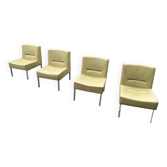 4 vintage fireside chairs in khaki skai with chrome metal base.