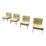 4 vintage fireside chairs in khaki skai with chrome metal base.