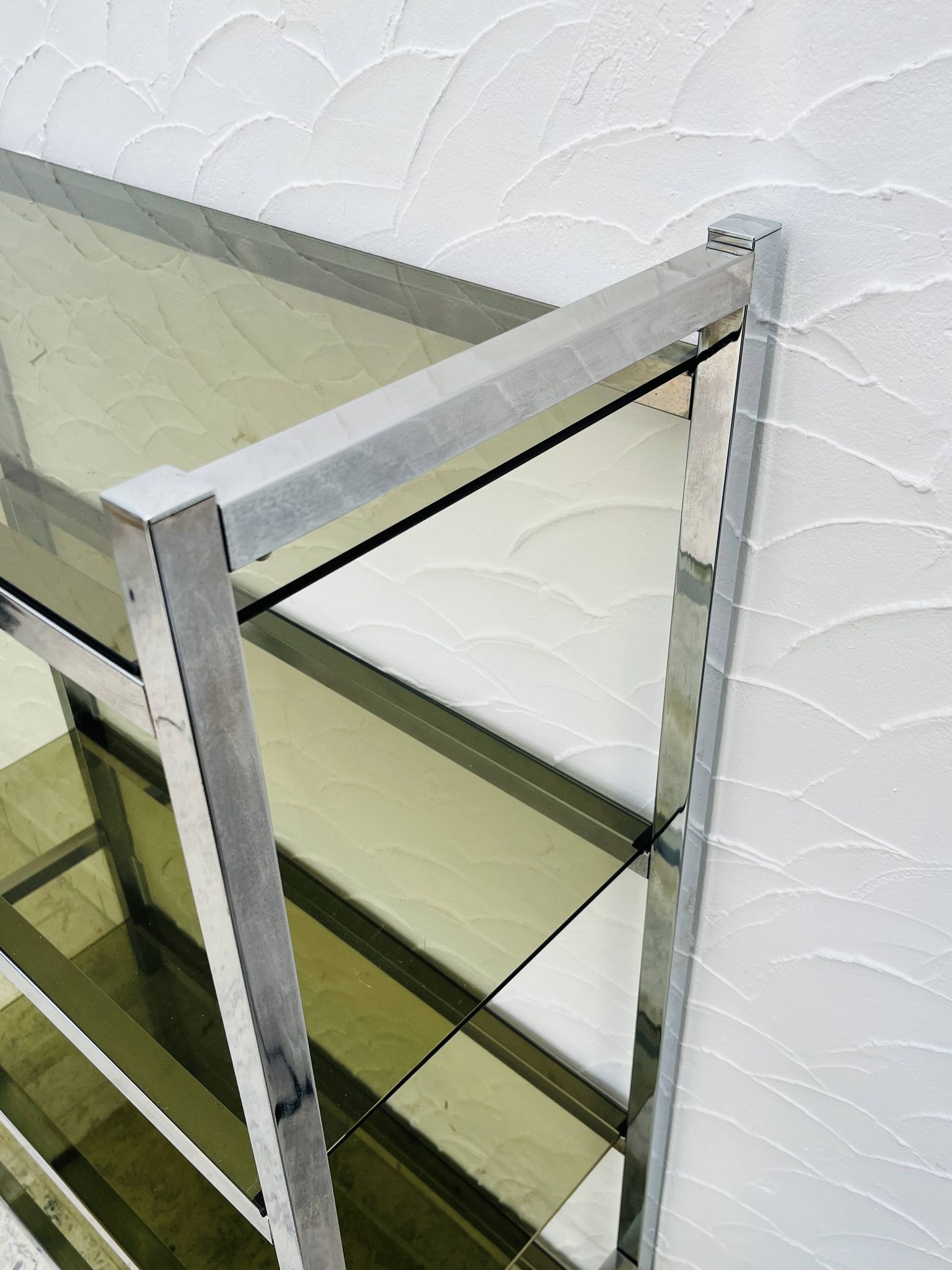 Chrome and smoked glass shelf in Italian 1970s style.