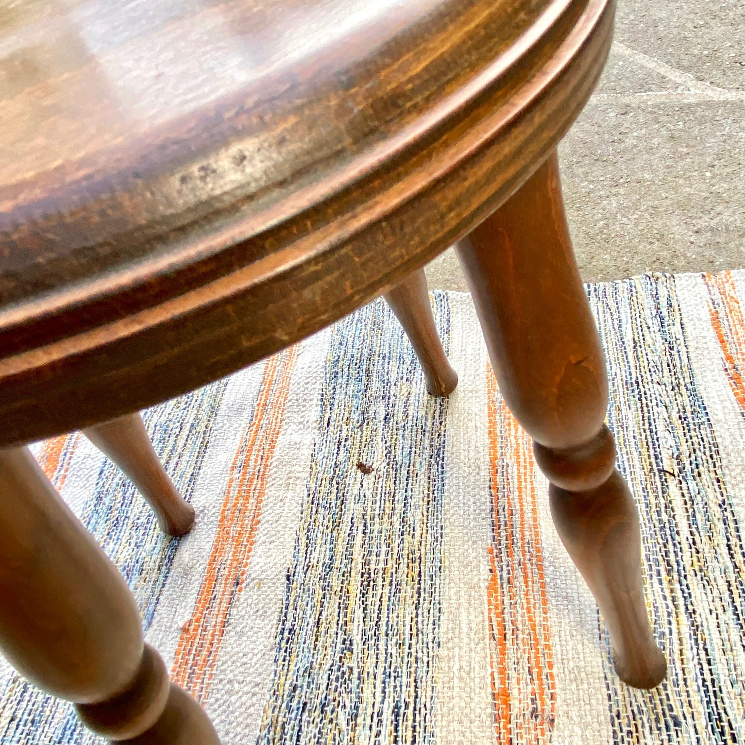 Vintage stool with turned wooden legs