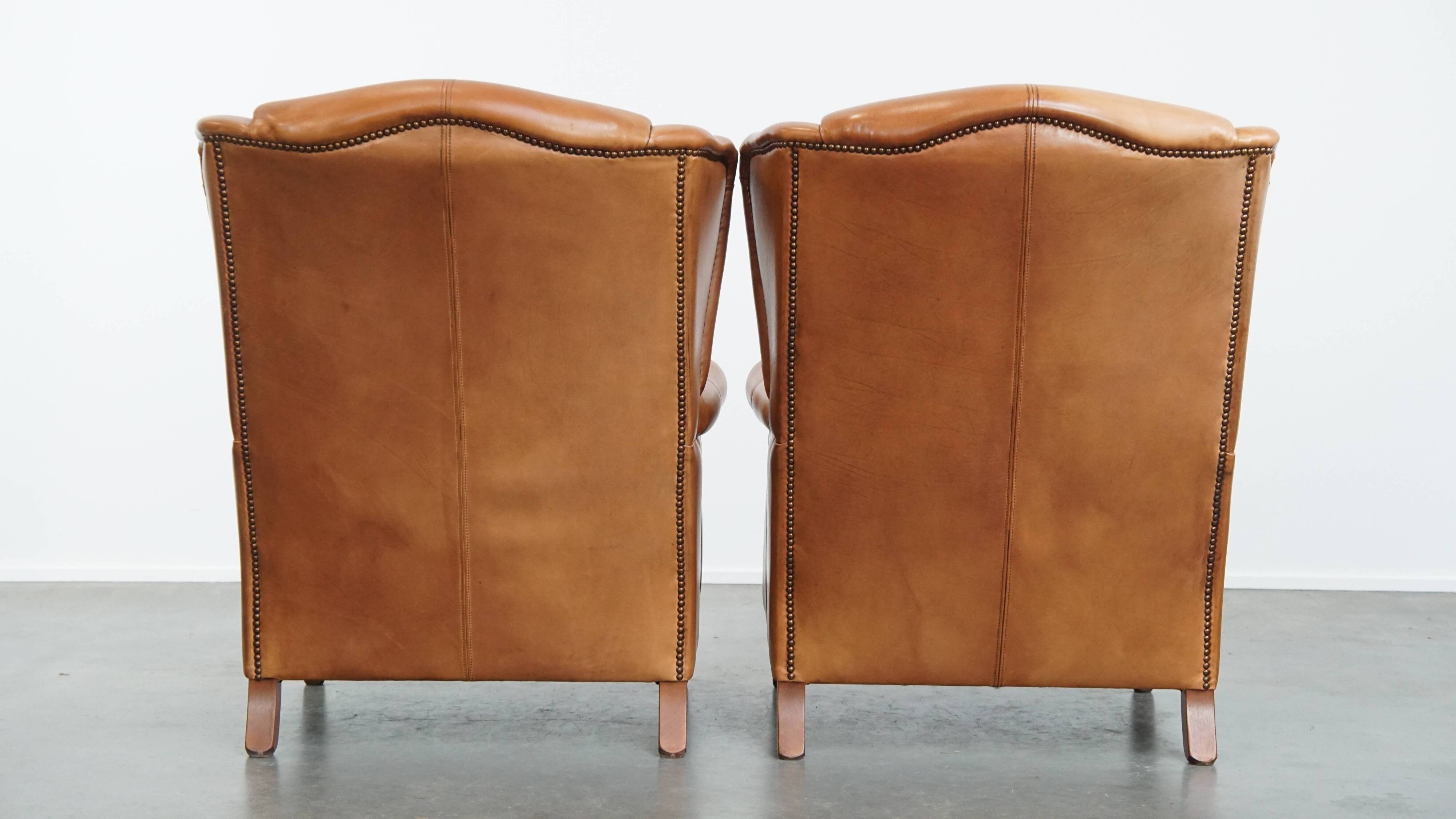 Set of 2 leather wingback chairs