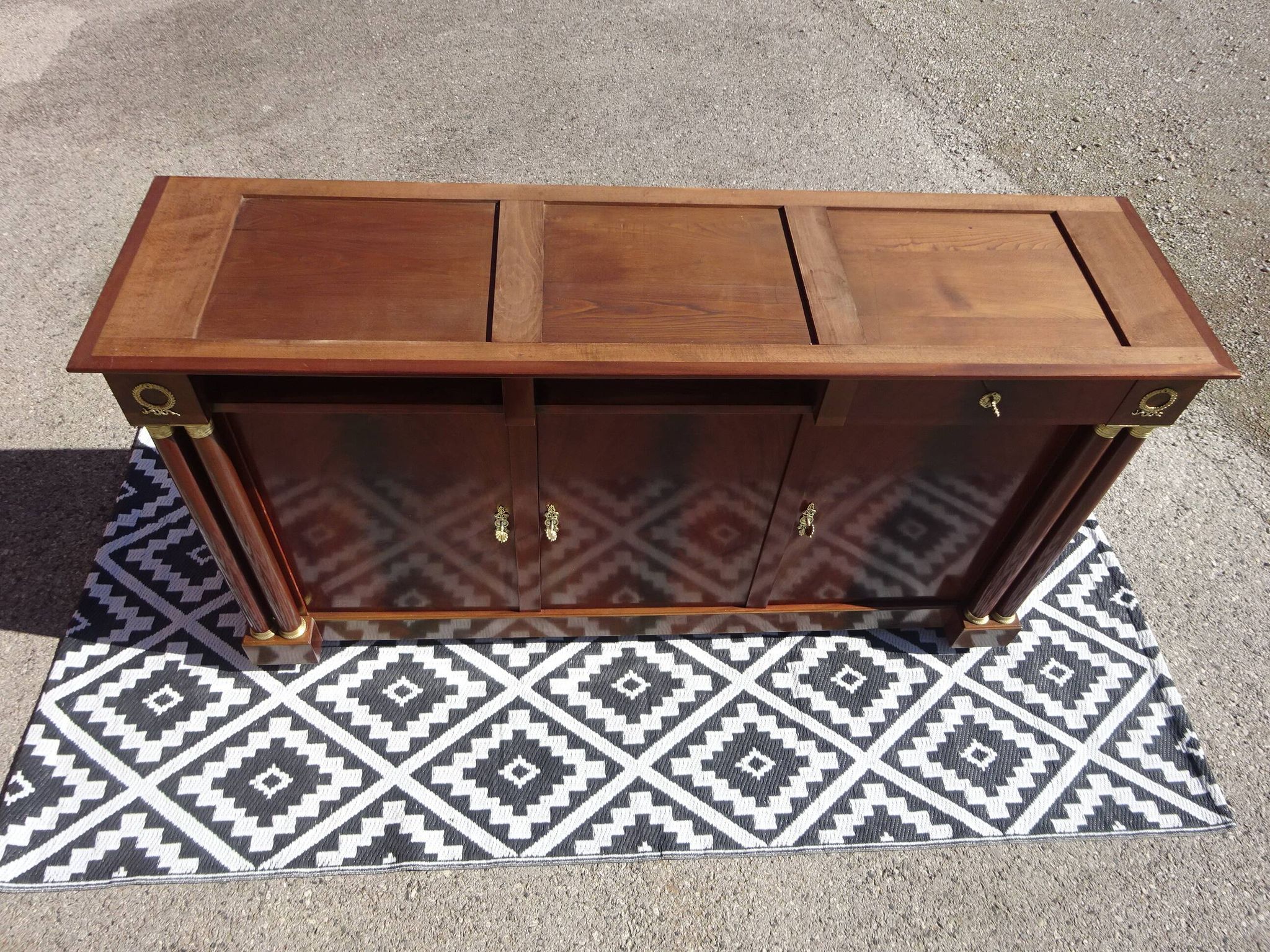 Flamed mahogany enfilade with sea green marble in Empire style.