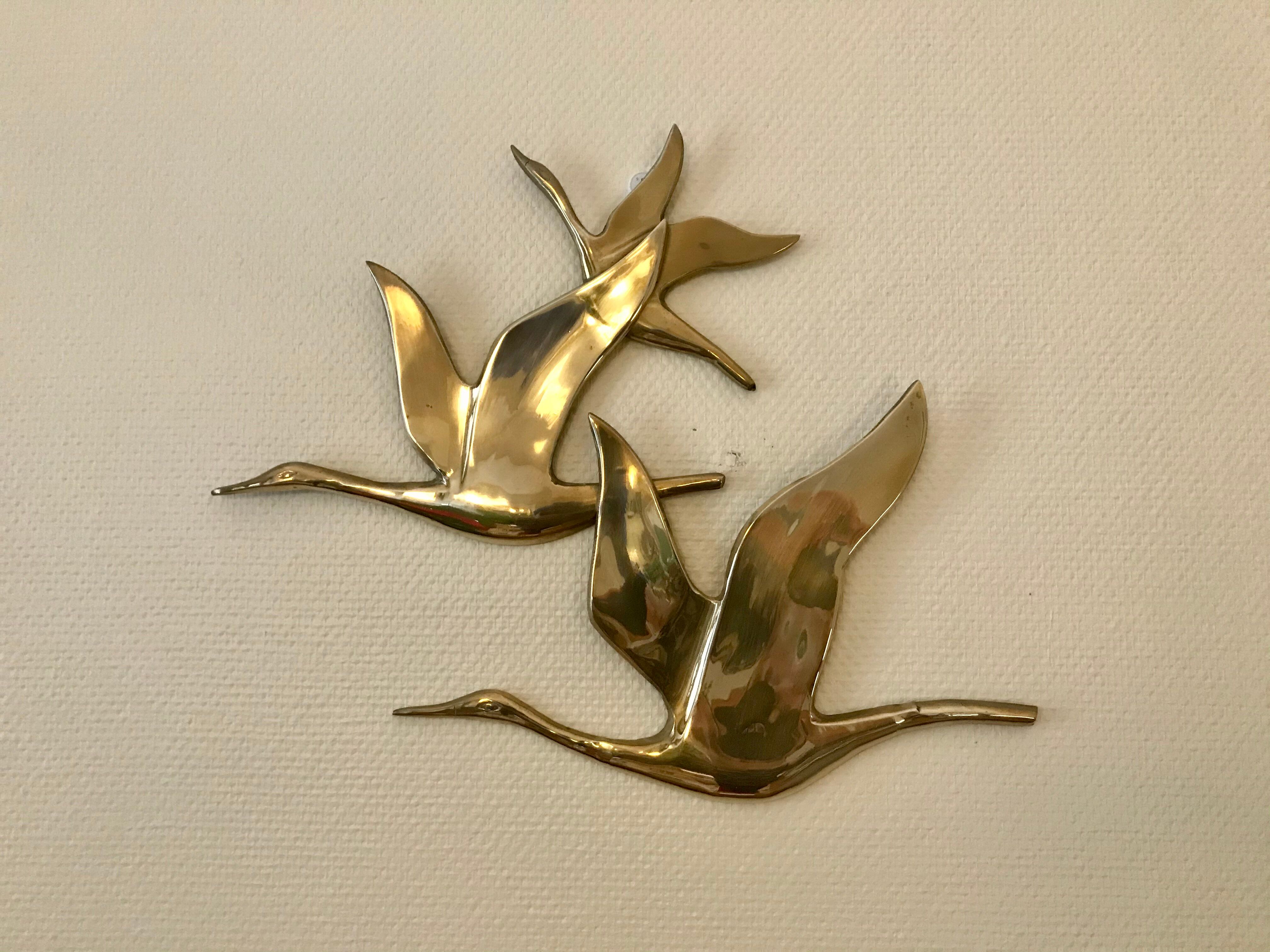 Birds in brass flight