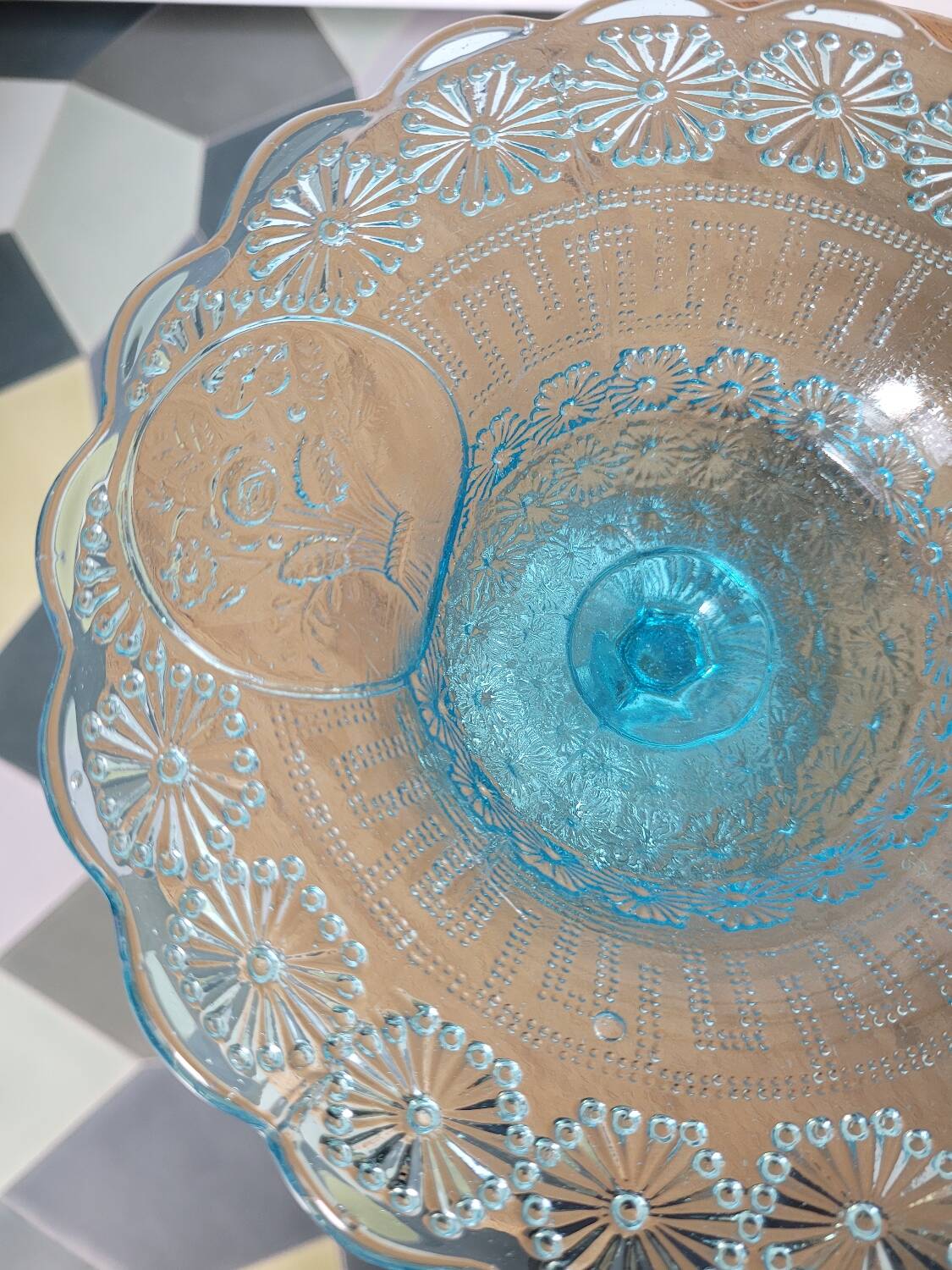 Plate on blue glass pedestal