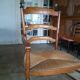 Large fauteuil paillé