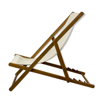 White fabric deckchair with wooden structure