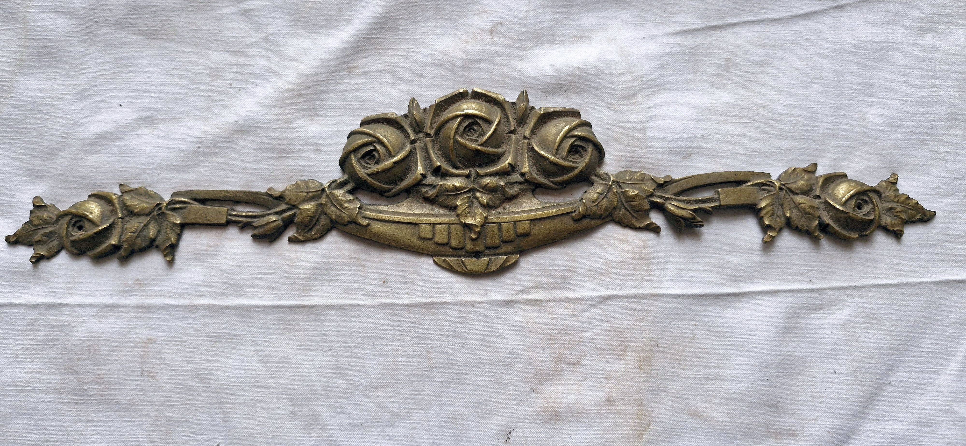 Old brass rose window, width 38cm.