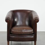 Stylish and sturdy dark brown club armchair made of sheepskin leather