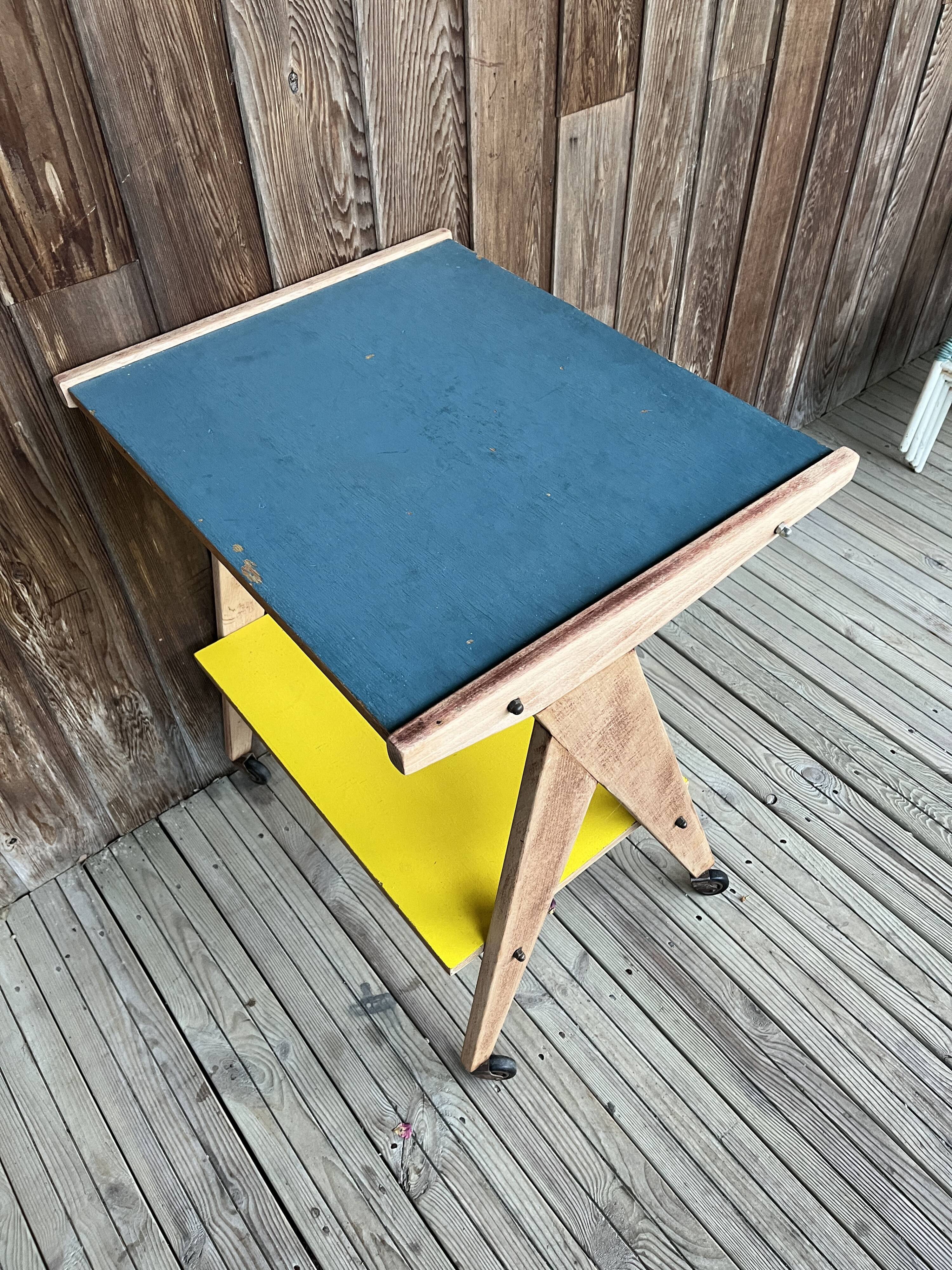 Yellow and blue serving trolley with compass base, 1950s