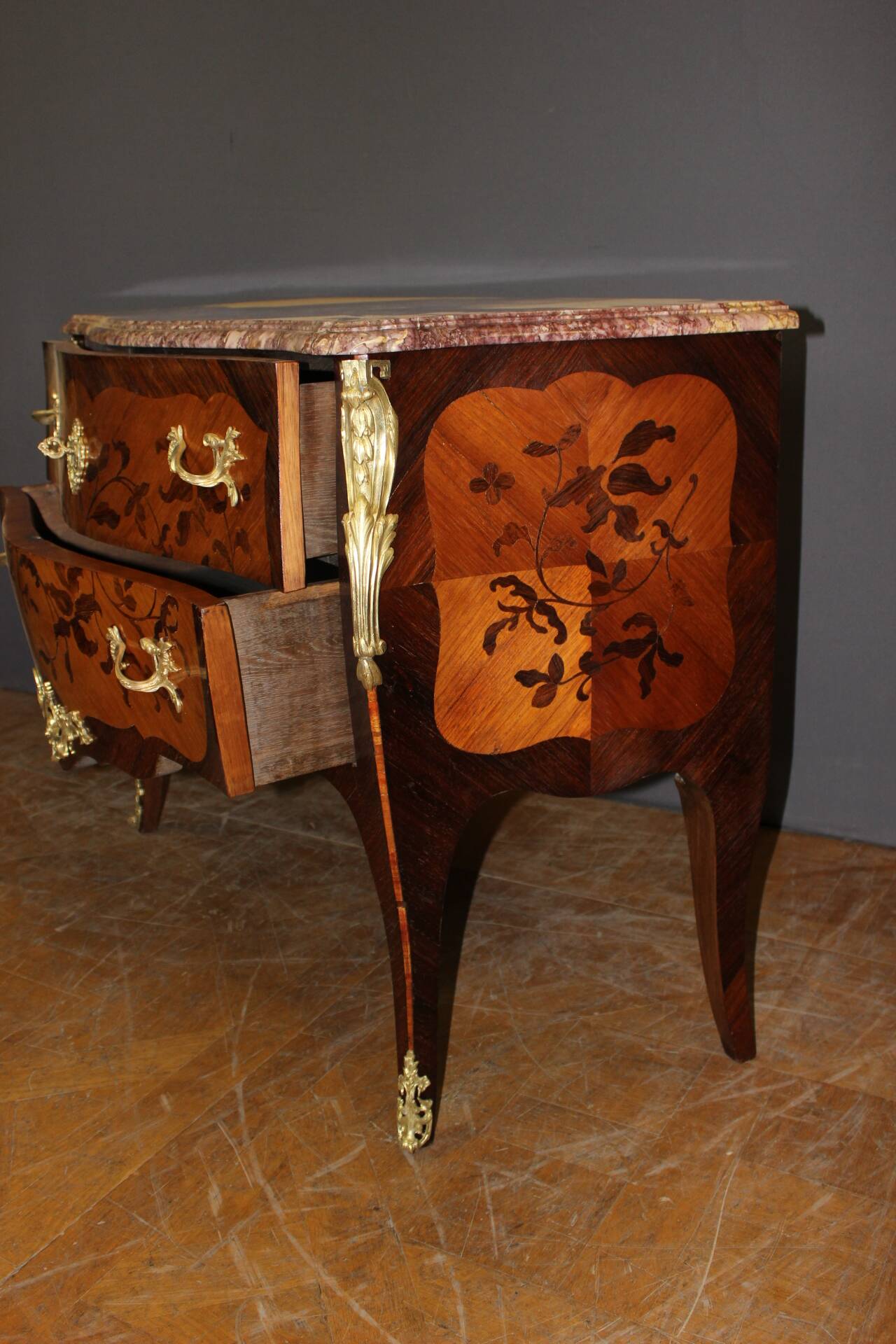 Louis XV style commode in marquetry from around 1930.