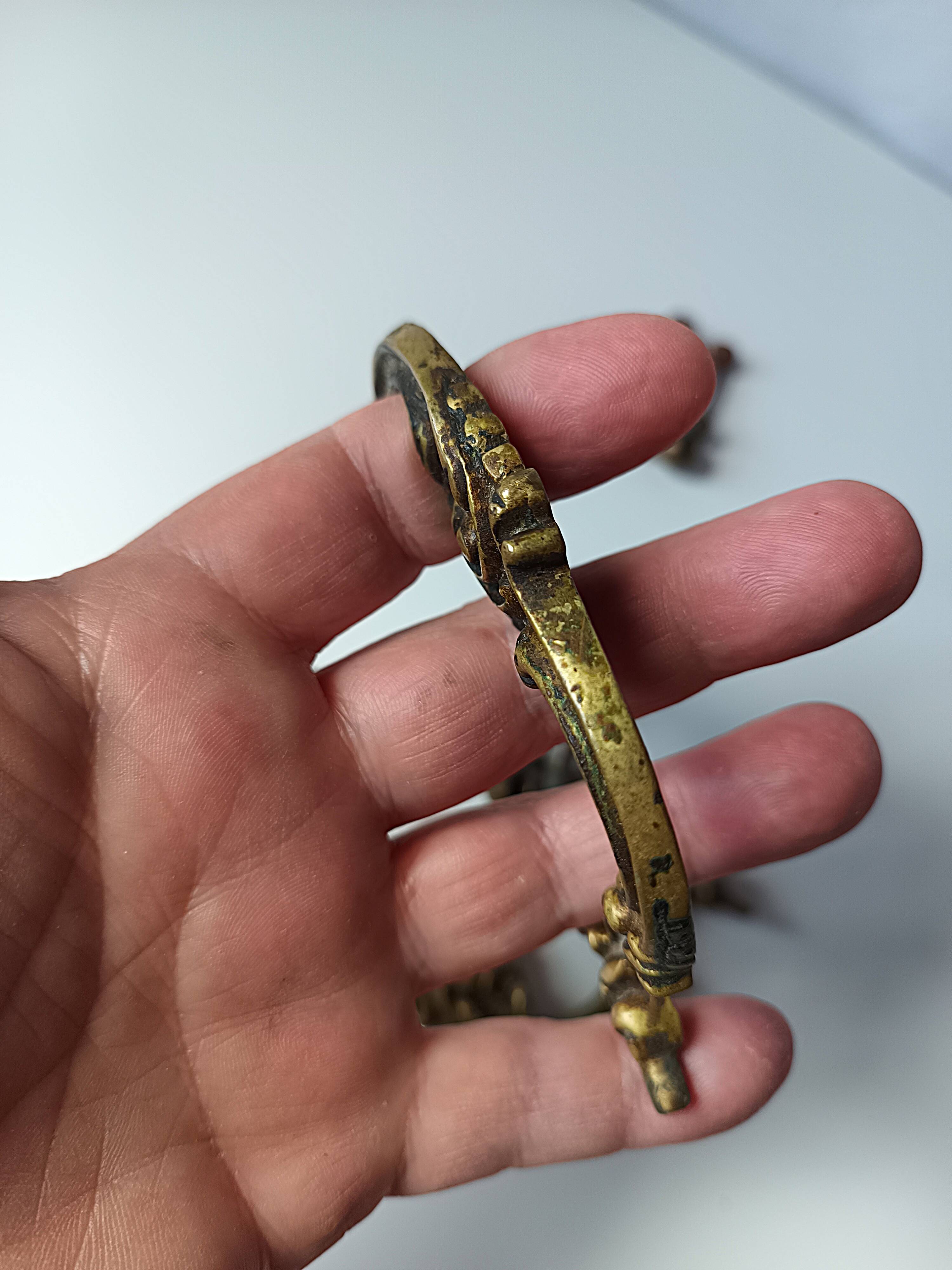 Antique pair of bronze drawer handles.