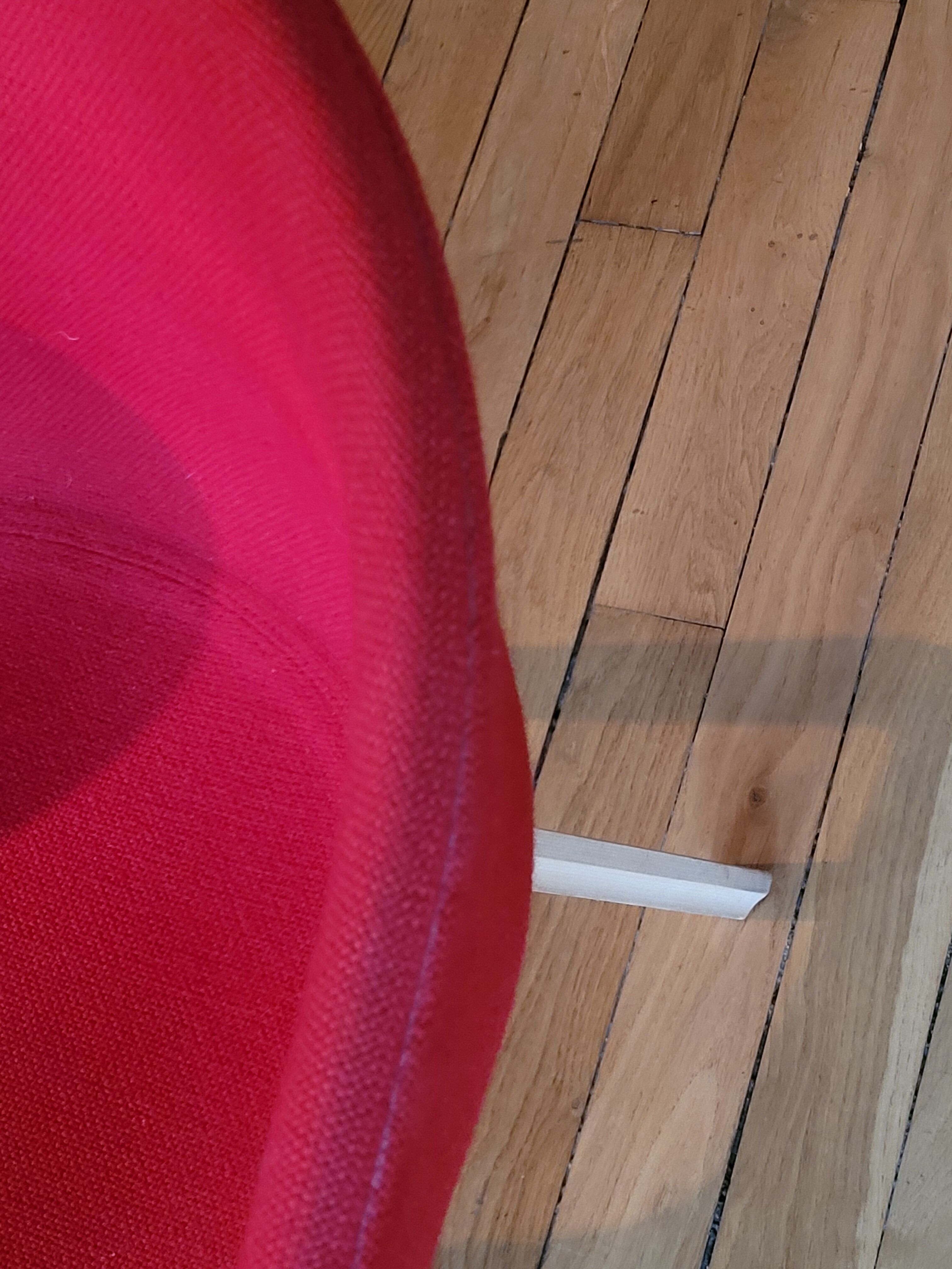 red canvas and wood armchair