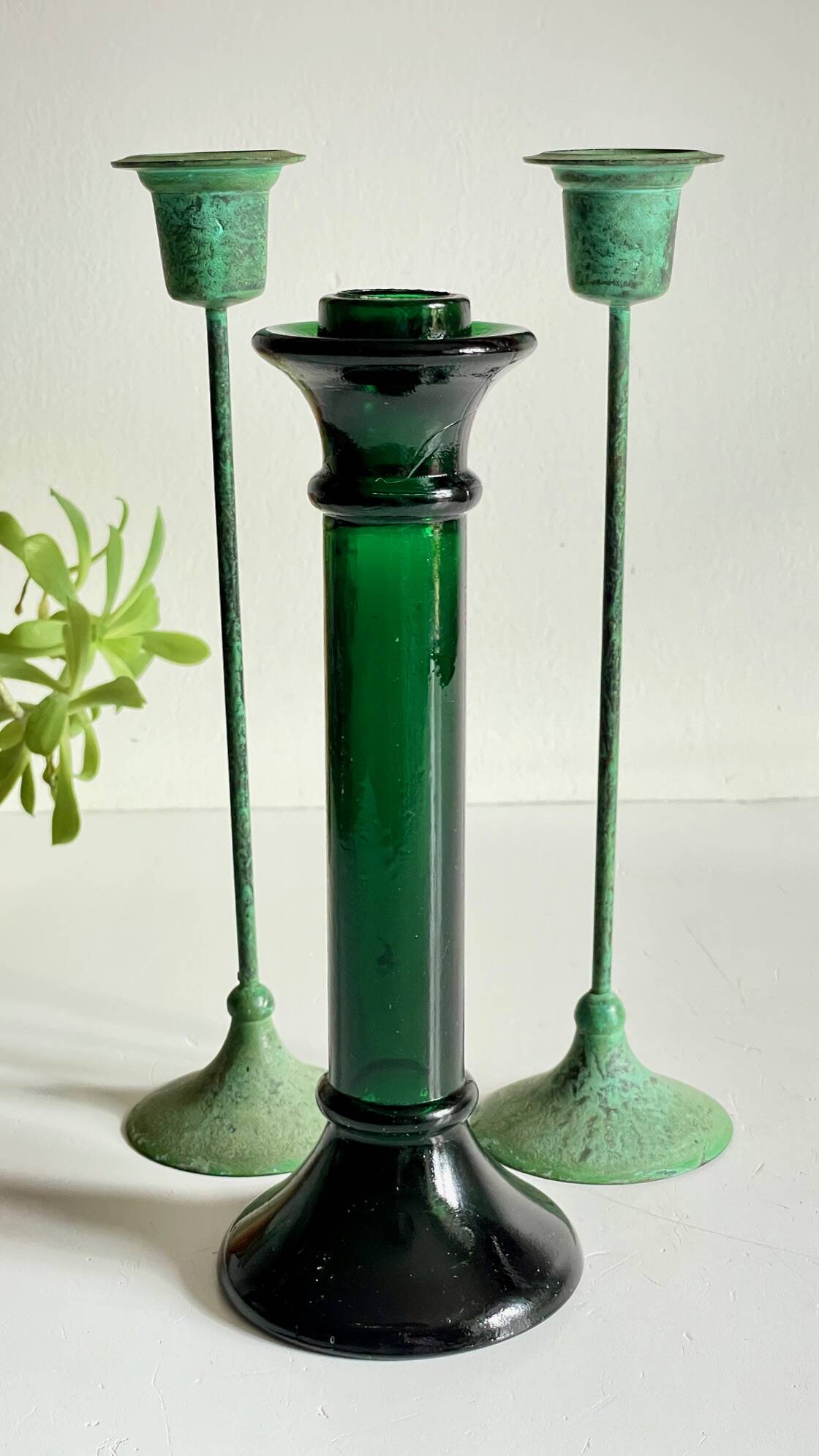 Green glass and metal candle holders