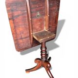 19th-century solid mahogany tilting table with a brass mechanism.