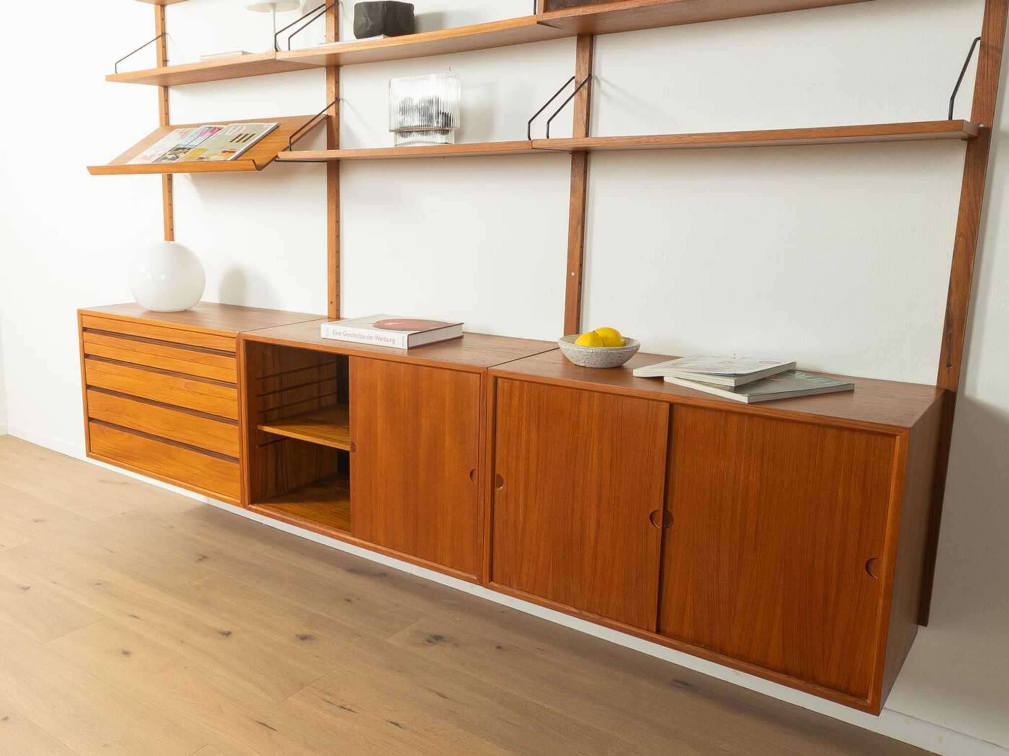 Classic shelving system from the 1960s in teak veneer by Poul Cadovius for Cado
