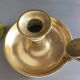 brass candle holder with old cellar rat thumb
