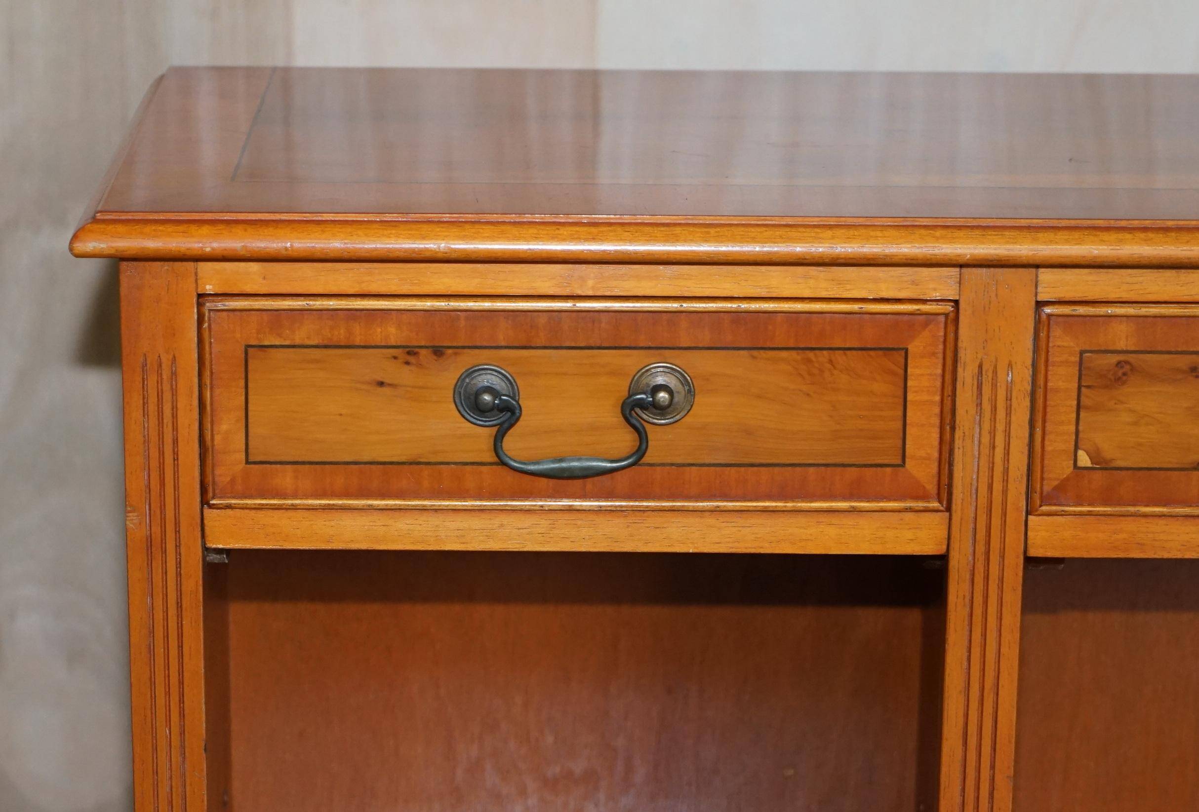 Vintage yew wood library/buffet with three drawers.