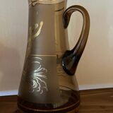 Vintage smoked glass carafe with gold from the 50s/60s, featuring a marine and water skiing design.