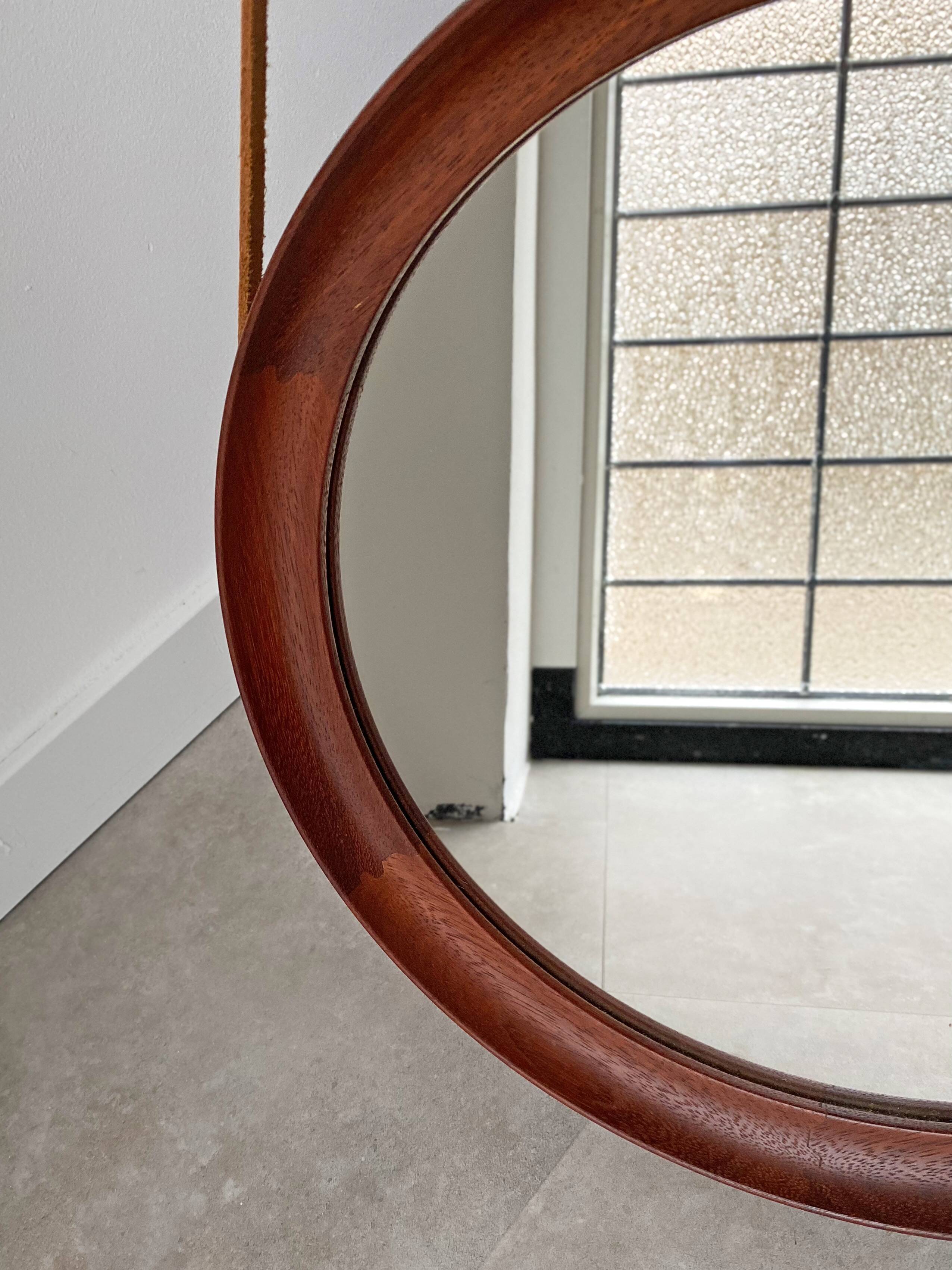 Mid Century solid teak wall mirror with a leather strap - Danish design