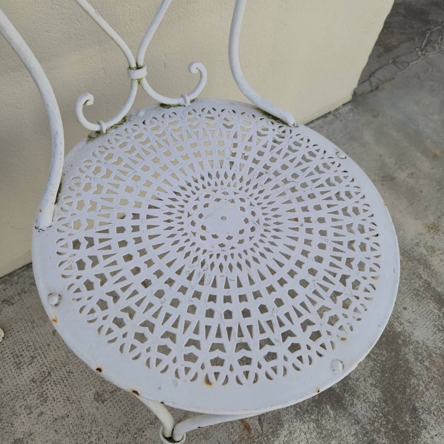 Pair of wrought iron garden chairs, antique manufacture