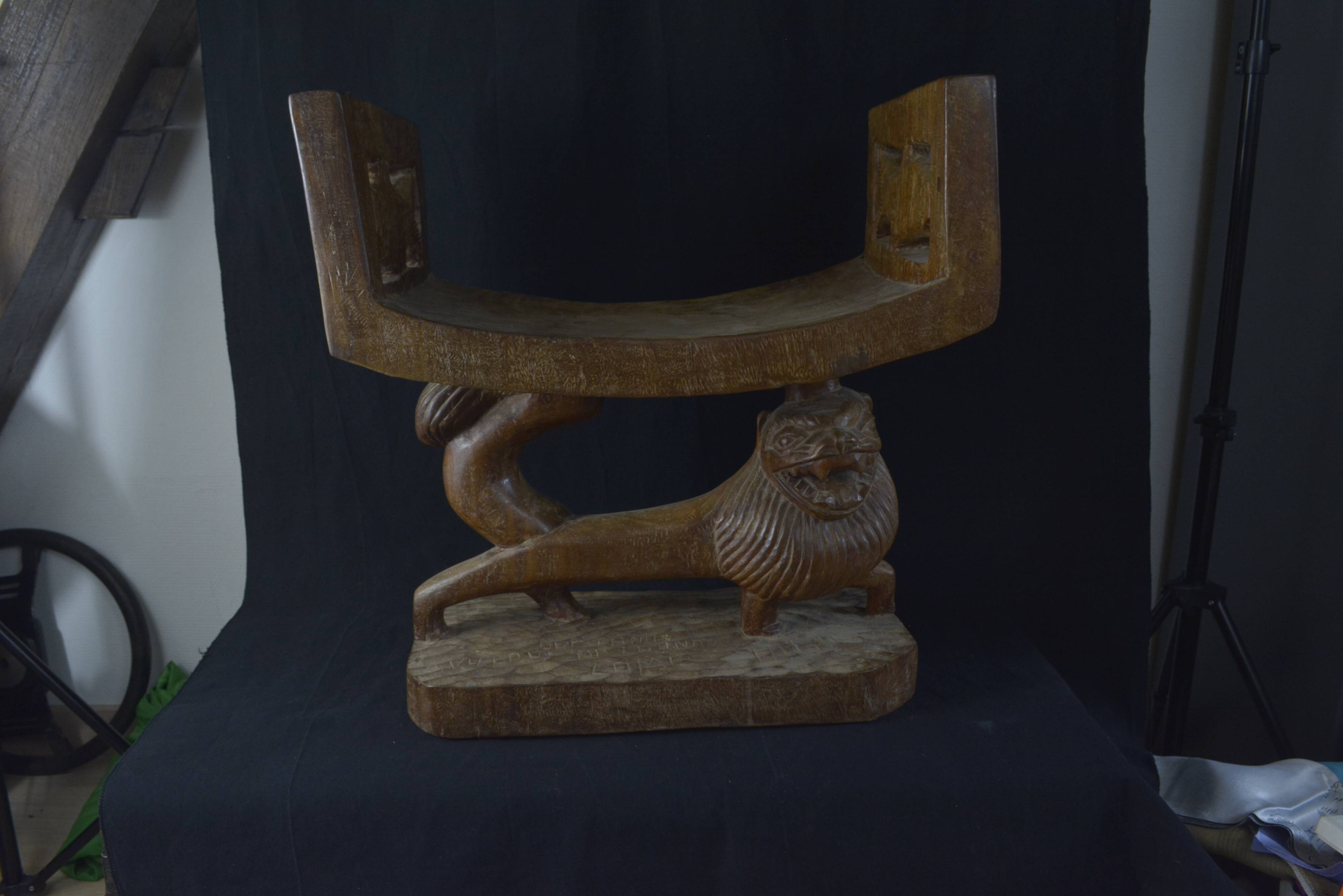 Togolese ethnic stool in carved exotic wood.