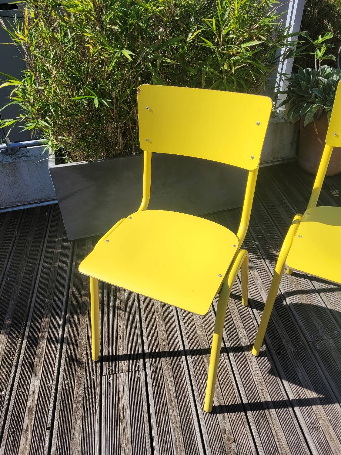 Pair of yellow plywood chairs
