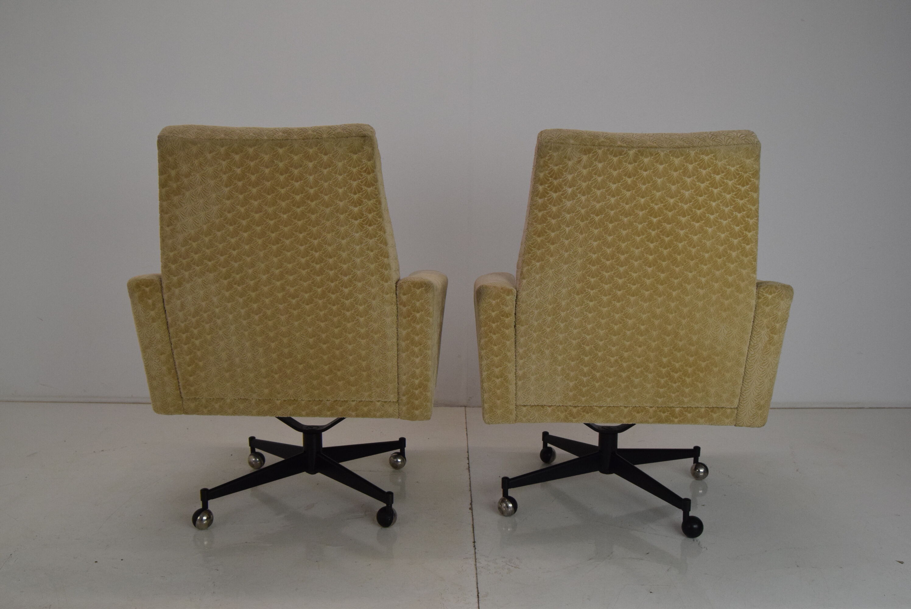 Pair of mid-century swivel armchairs with wheels 1970's