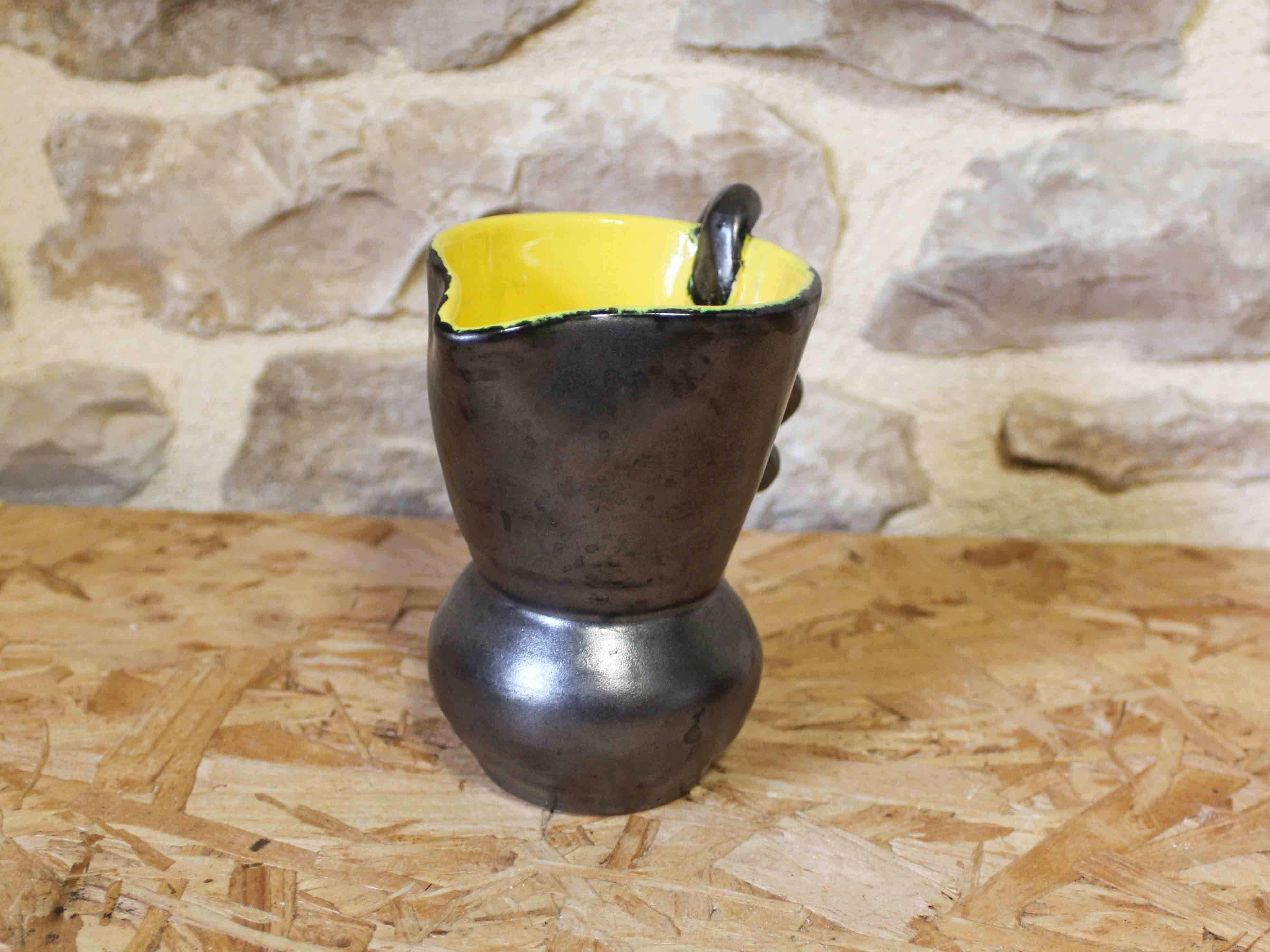Ceramic jug with a twisted handle
