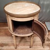 Round bedside table painted in trompe l'oeil