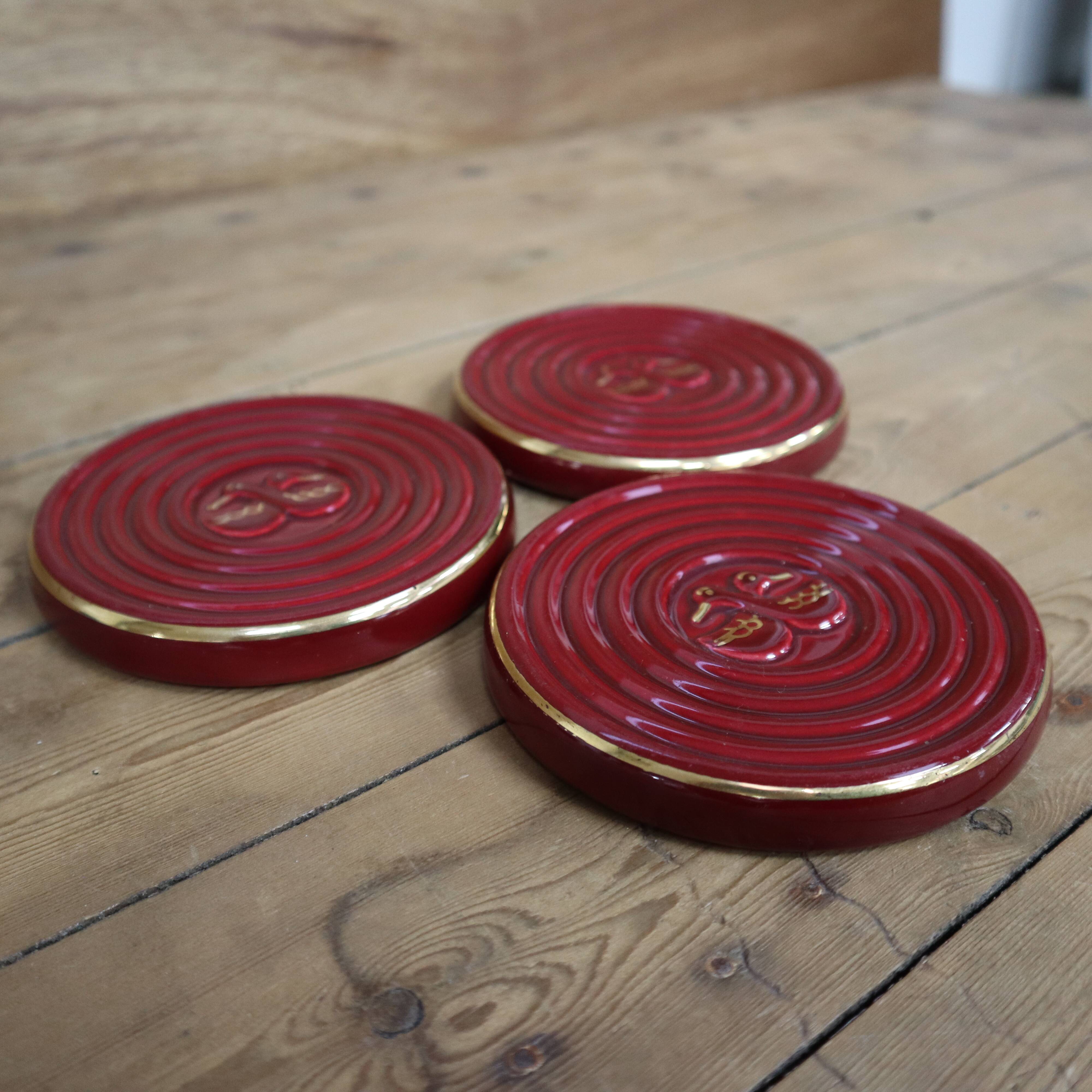 3 small vintage burgundy duck coasters or glasses with gold edging