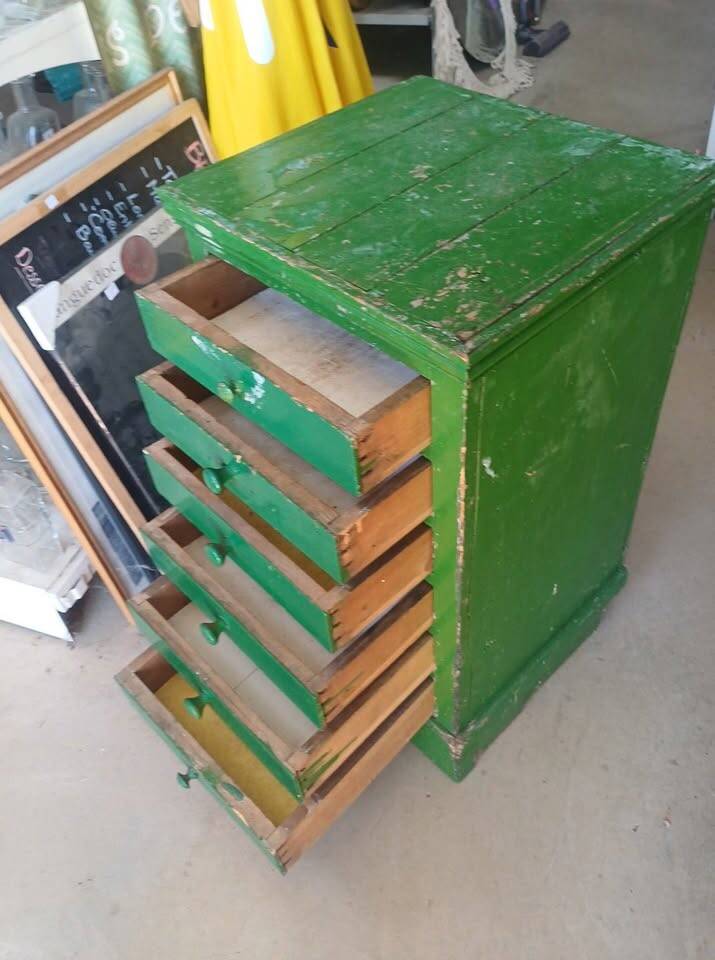 Vintage workshop furniture with 6 green drawers.