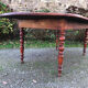 Antique cherry wood farmhouse table with rounded ends