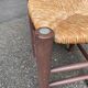 Traditional farmhouse stool in solid wood with straw seat.
