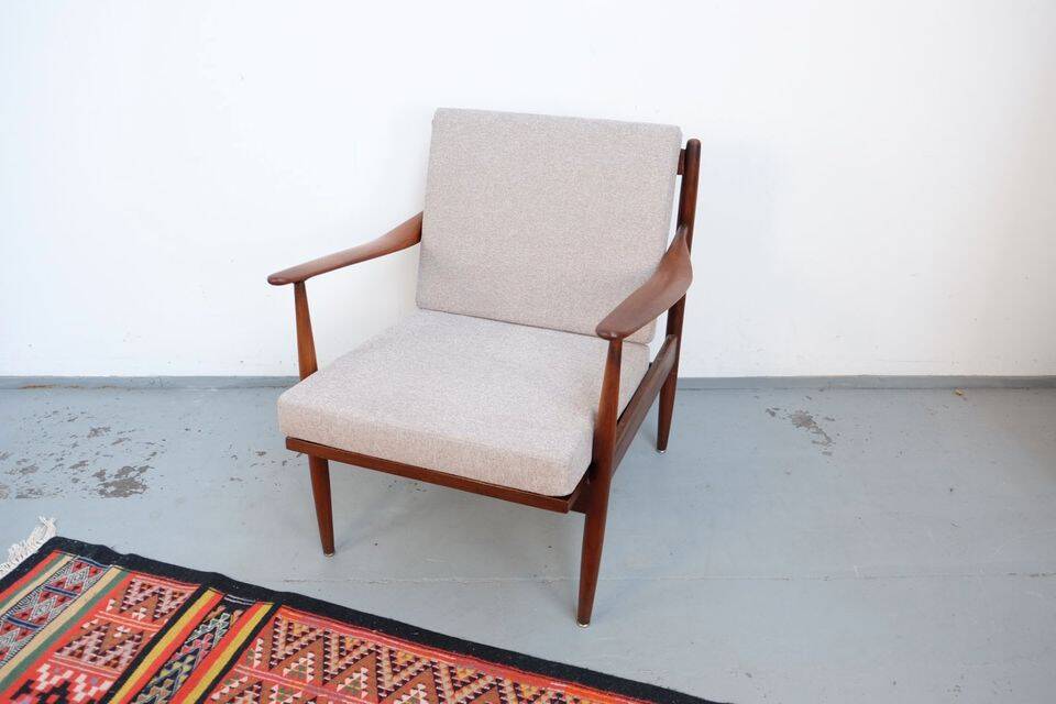Vintage teak lounge chair, retro 1960s–70s style.