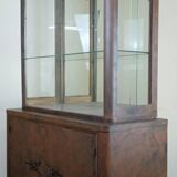 Art Deco period bookcase in lacquered wood with a faux appearance of rust-patinated sheet metal circa 1930-1940