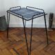 Vintage side table in twisted wrought iron and glazed ceramic.