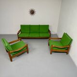 Living room sofa and Scandinavian design armchairs from the 1960s in green boucle.