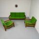 Living room sofa and Scandinavian design armchairs from the 1960s in green boucle.